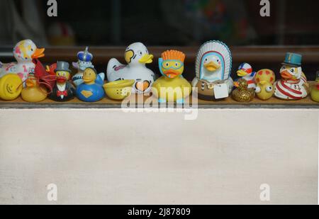 closeup of small colorful  plastic ducks in a window  in paris france Stock Photo