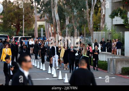 May 12, 2022, San Diego, California, USA: Spectators exit the Louis Vuitton's 2023 Cruise Show at the Salk Institute for Biological Studies. (Credit Image: © K.C. Alfred/ZUMA Press Wire) Stock Photo