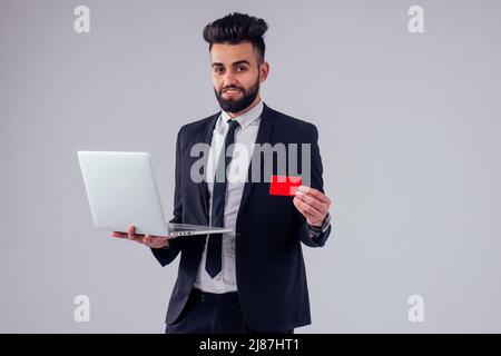 young handsome black hair man in stylish business suit in studio isolate white background Stock Photo
