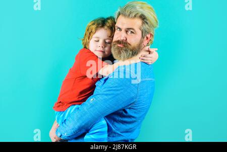 Fathers day. Father and little son hugging. Family relationships. Parenthood and childhood concept. Stock Photo