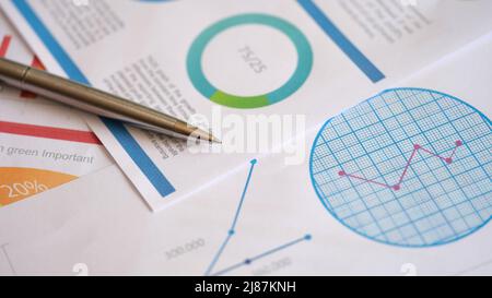 Analysis of financial statements and line charts Stock Photo