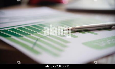 Paper document with pen graphs and diagrams Stock Photo