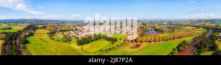 Green pastures around Bega agriculture town in Bega Valley of NSW, Australia – aerial panorama. Stock Photo