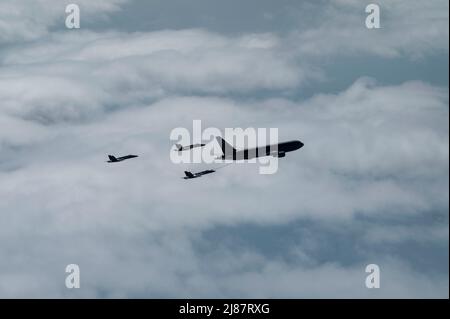 A KC-46A Pegasus assigned to the 916th Air Refueling Wing in-air refuels the U.S. Navy Blue Angels as they fly from Florida to South Dakota for an airshow at Ellsworth Air Force Base, South Dakota. In-air refueling is utilized to extend an aircraft’s range when flying long distances. (U.S. Air Force photo by Senior Airman Kevin Holloway) Stock Photo