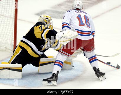 Pittsburgh, USA. 13th May, 2022. Pittsburgh Penguins goaltender Louis Domingue (70) bats the puck away from New York Rangers center Andrew Copp (18) during the first period in game six of the first round of the Stanley Cups Playoffs at PPG Paints Arena in Pittsburgh on Friday, May 13, 2022. Photo by Archie Carpenter/UPI Credit: UPI/Alamy Live News Stock Photo
