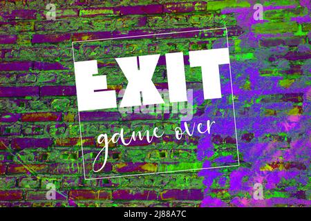 White exit word and game over. letters on brick wall. gaming concept Stock Photo