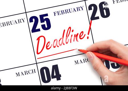 25th day of February. Hand drawing red line and writing the text Deadline on calendar date February 25. Deadline word written on calendar Winter month Stock Photo