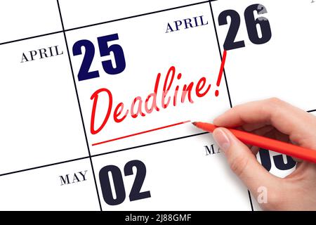 25th day of April.  Hand drawing red line and writing the text Deadline on calendar date April 25. Deadline word written on calendar Spring month, day Stock Photo