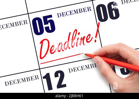 5th day of December. Hand drawing red line and writing the text Deadline on calendar date December 5. Deadline word written on calendar Winter month, Stock Photo