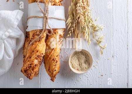 Delicious bread sticks freshly baked in home bakery. Grissini made in the bakery. Stock Photo