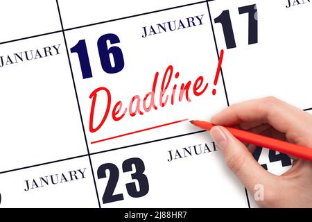 16th day of January. Hand drawing red line and writing the text Deadline on calendar date January 16. Deadline word written on calendar Winter month, Stock Photo