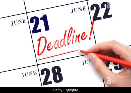 21st day of June. Hand drawing red line and writing the text Deadline on calendar date June 21. Deadline word written on calendar Summer month, day of Stock Photo