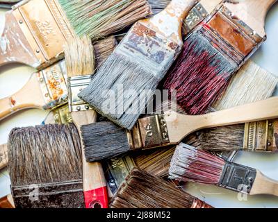 Pile of used and dried paint brushes shot from above Stock Photo