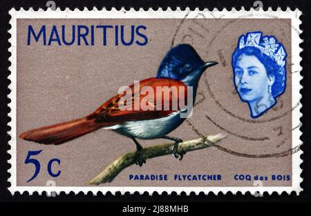 MAURITIUS - CIRCA 1965: a stamp printed in the Mauritius shows Mauritius Paradise Flycatcher, Terpsiphone Bourbonnensis, Bird, circa 1965 Stock Photo