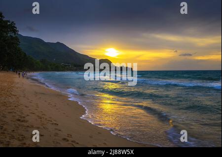 Sunset over the Beau Vallon Beach on the island of Mahe, Seychelles Stock Photo