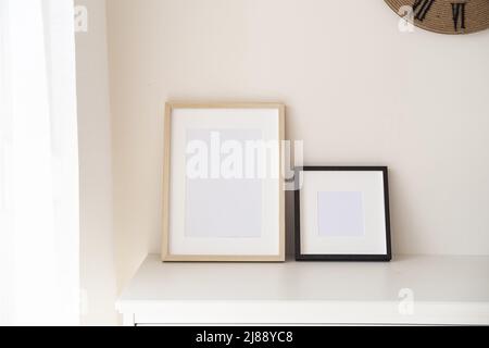 Wooden frames with empty space in the bedroom.  Stock Photo