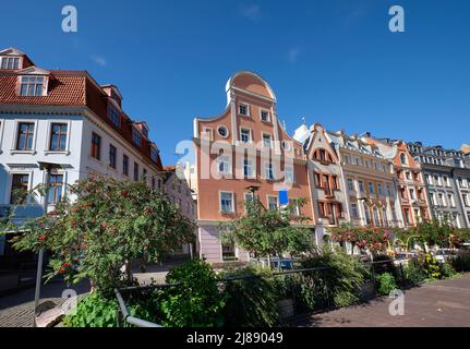 Riga old town, Latvia in Summer. Historic houses and plants by street cafe in Old Town, Vecriga. Stock Photo
