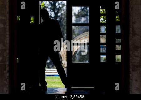 Nicosia, Cyprus. 13th May, 2022. Tha silhouette of a member of the Presidential Guard is seen in the Presidential Palace, Nicosia, Cyprus, on May. 13, 2022. The President of the Republic, Mr Nicos Anastasiades, receives the former President of the Hellenic Republic, Mr Prokopis Pavlopoulos, at the Presidential Palace. (Photo by Kostas Pikoulas/Sipa USA) Credit: Sipa USA/Alamy Live News Stock Photo