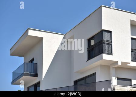 Modern house with corner window and flat roof Stock Photo