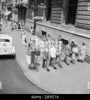 Traffic on Fifth Avenue approaching 57th Street on a summer afternoon. New York City. Stock Photo