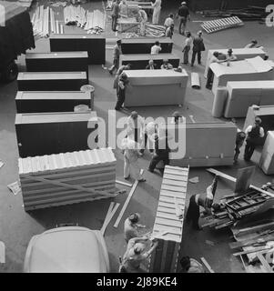 Washington, D.C. United States government workers and carpenters making crates for steel cabinets and preparing them for shipment in the rear of the Auditor's Building at 14th Street and Independence Avenue. Stock Photo