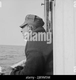 On board the fishing boat Alden out of Gloucester, Massachusetts. Pasquale Maniscaleo, engineer. Stock Photo