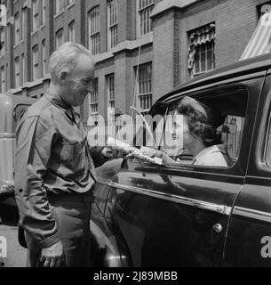 [Untitled photo, possibly related to: New Britain, Connecticut. Women employed at Landers, Frary and Clark plant. A shuttle driver]. Stock Photo