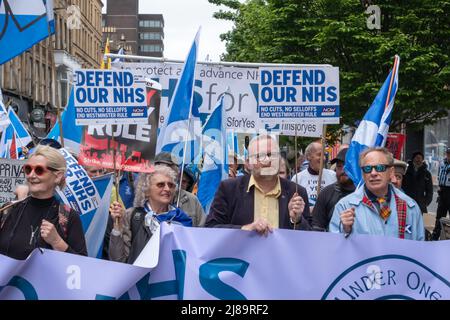 Glasgow, Scotland, UK. 14th May, 2022. Martyn Day (2nd right) SNP MP for Linlithgow and East Falkirk joins Scottish independence supporters on the march from Kelvingrove Park through the city centre to a rally in  George Square. The event was organised by the group All Under One Banner. Credit: Skully/Alamy Live News Stock Photo