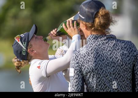 BANG KAPONG THAILAND - May 14:  Manon De Roey of Belgium drinks champagne from the bottle after winning the Aramco Team Series (individual) at Thai Country Club on May 14, 2022 in Bang Kapong, Thailand (Photo by Orange Pictures) Stock Photo