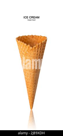 An empty waffle cone is isolated on a white background. Stock Photo