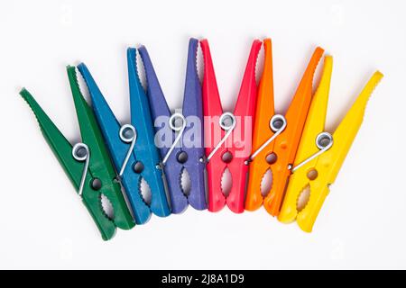 Clothes pegs or pin multicolor for house isolated on the white background Stock Photo