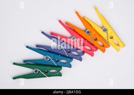 Clothes pegs or pin multicolor for house isolated on the white background Stock Photo