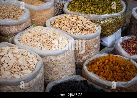 bags of nuts, seeds and raisins, food ingredients on market (Suq, Damascus) Stock Photo