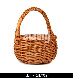 Wicker brown basket isolated on the white background Stock Photo