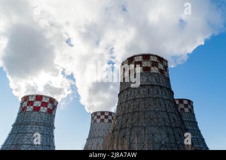 Thermal power plant, the smoke extracted by a thermal power plant on the chimney, in the production process. Environment. Pollution. Stock Photo
