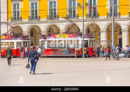 Lisbon, Portugal - March 27, 2018: Red tram, and people at downtown square Stock Photo