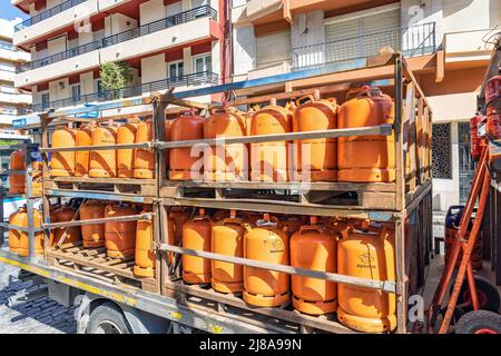 Huelva, Spain - May 10, 2022: A truck delivering orange butane bottles from the Repsol company Stock Photo