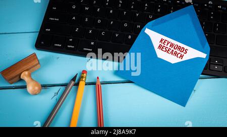Keywords Research. Letter on black computer keyboard. Stock Photo