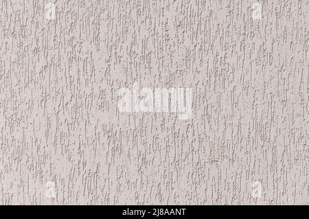 Texture of beige plaster building coating background. Arbitrary pattern. Stock Photo