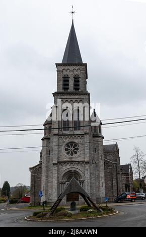 Bassenge, Liege, Belgium - 04 03 2022 - The square and catholic church tower of the village Stock Photo