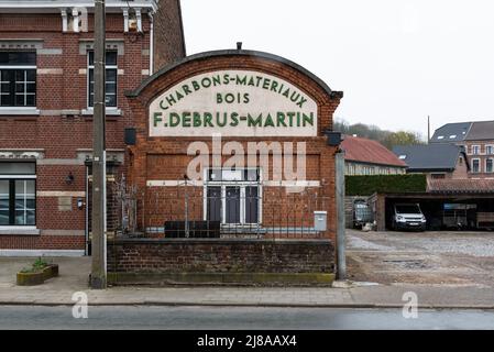 Bassenge, Liege, Belgium - 04 03 2022 - Facade and entrance of an old Charcoal and construction material industry plant Stock Photo