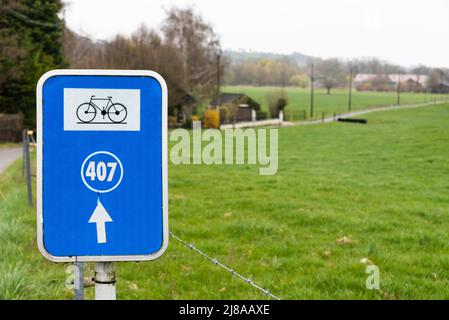 Bassenge, Liege, Belgium - 04 03 2022 - Blue sign of the biking trail nodes at the waloon countryside Stock Photo