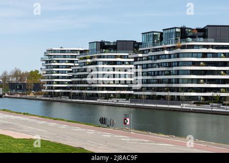 Hasselt, Limburg, Belgium - 04 12 2022 - Contemporary luxurious apartment blocks at the bank of the ALbert Canal Stock Photo