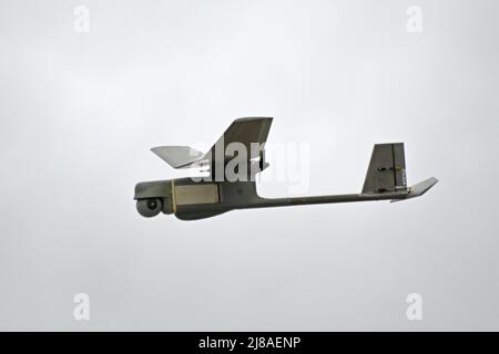 A U.S. Marine Corps RQ-11 Raven fixed wing unmanned aerial system in flight during UAS training at Range 86 on the Fort Dix Range Complex, May 11, 2022 near Trenton, New Jersey. Stock Photo