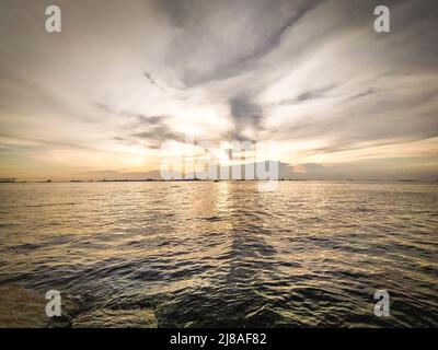 Sunset seascape bright evening sky during evening sunset nature background Stock Photo
