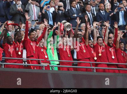 Jordan Henderson Of Liverpool Lifts The Cup During The Uefa Champions 