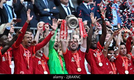 London, UK. 14th May, 2022. Jordan Henderson (Liverpool) holds the FA Cup aloft and celebrates during the FA Cup Final match between Chelsea and Liverpool at Wembley Stadium on May 14th 2022 in London, England. (Photo by Garry Bowden/phcimages.com) Credit: PHC Images/Alamy Live News Stock Photo