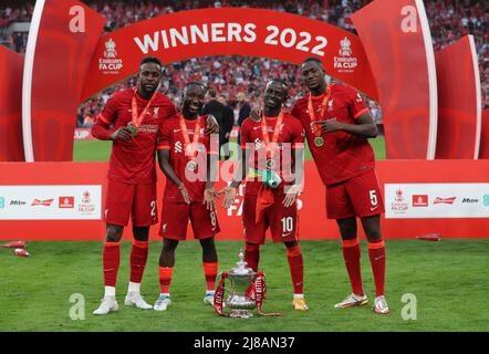 London, UK. 14th May, 2022. (L-R) Divock Orig, Naby Keita, Sadio Mané and Ibrahima Konaté of Liverpool with the FA Cup after his team win the Emirates FA Cup match at Wembley Stadium, London. Picture credit should read: Paul Terry/Sportimage Credit: Sportimage/Alamy Live News Stock Photo