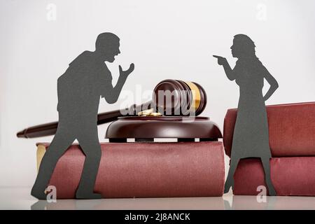 couple a man and a woman quarrel. the concept of emotional aggression between husband and wife. problems in the relationship. silhouette people shout Stock Photo