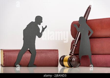 couple a man and a woman quarrel. the concept of emotional aggression between husband and wife. problems in the relationship. silhouette people shout Stock Photo